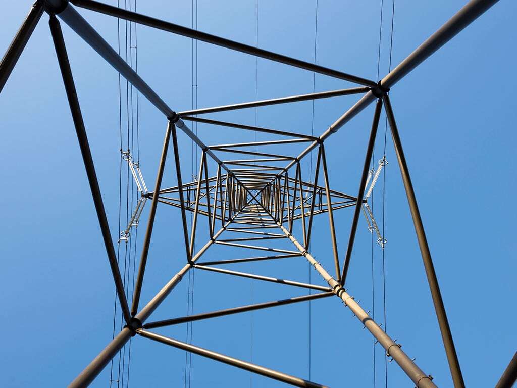 Energy post as a metaphor for critical infrastructure, view from the bottom; © iStock 2164230577